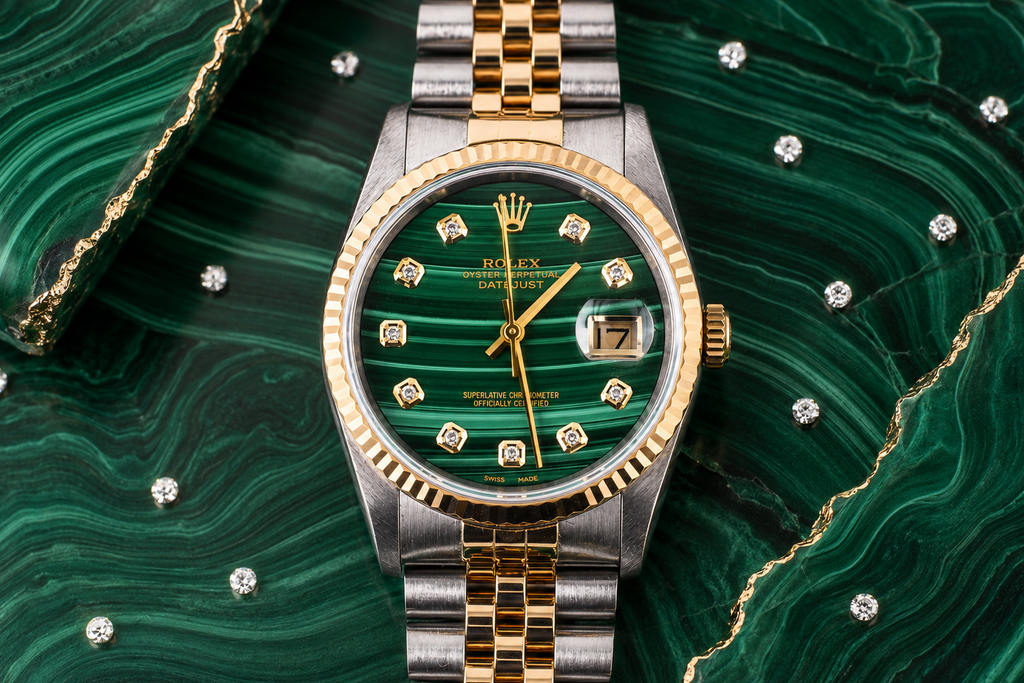 Luxury watch with green face and gold accents on a green textured background