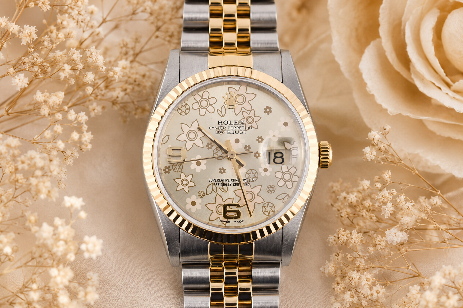 Luxury watch with floral dial on a decorative background