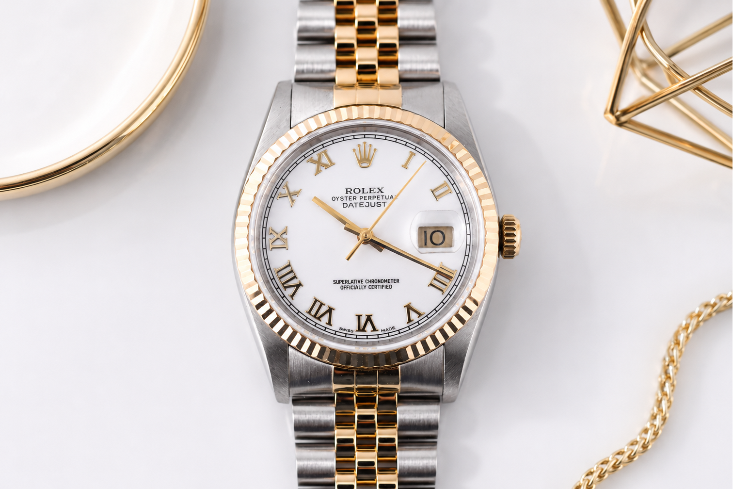 Luxury watch with gold and silver band on a white background