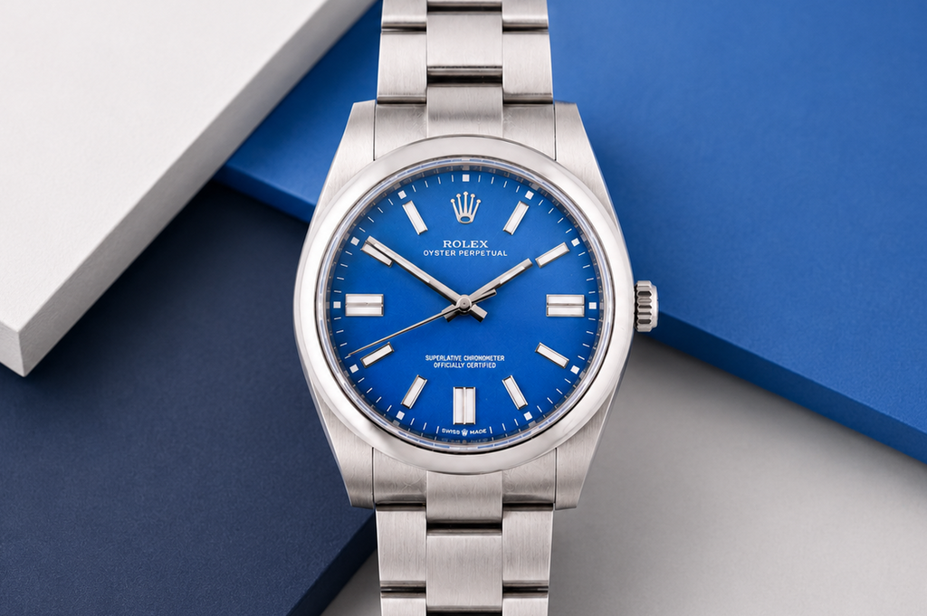 Silver watch with a blue face on a geometric background