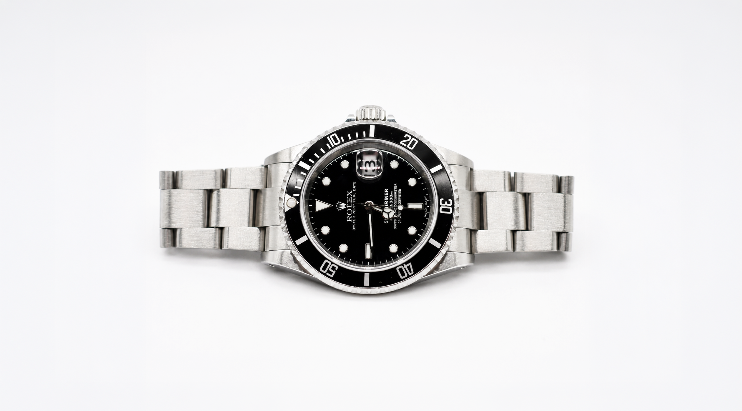 Silver watch with a black face on a white background