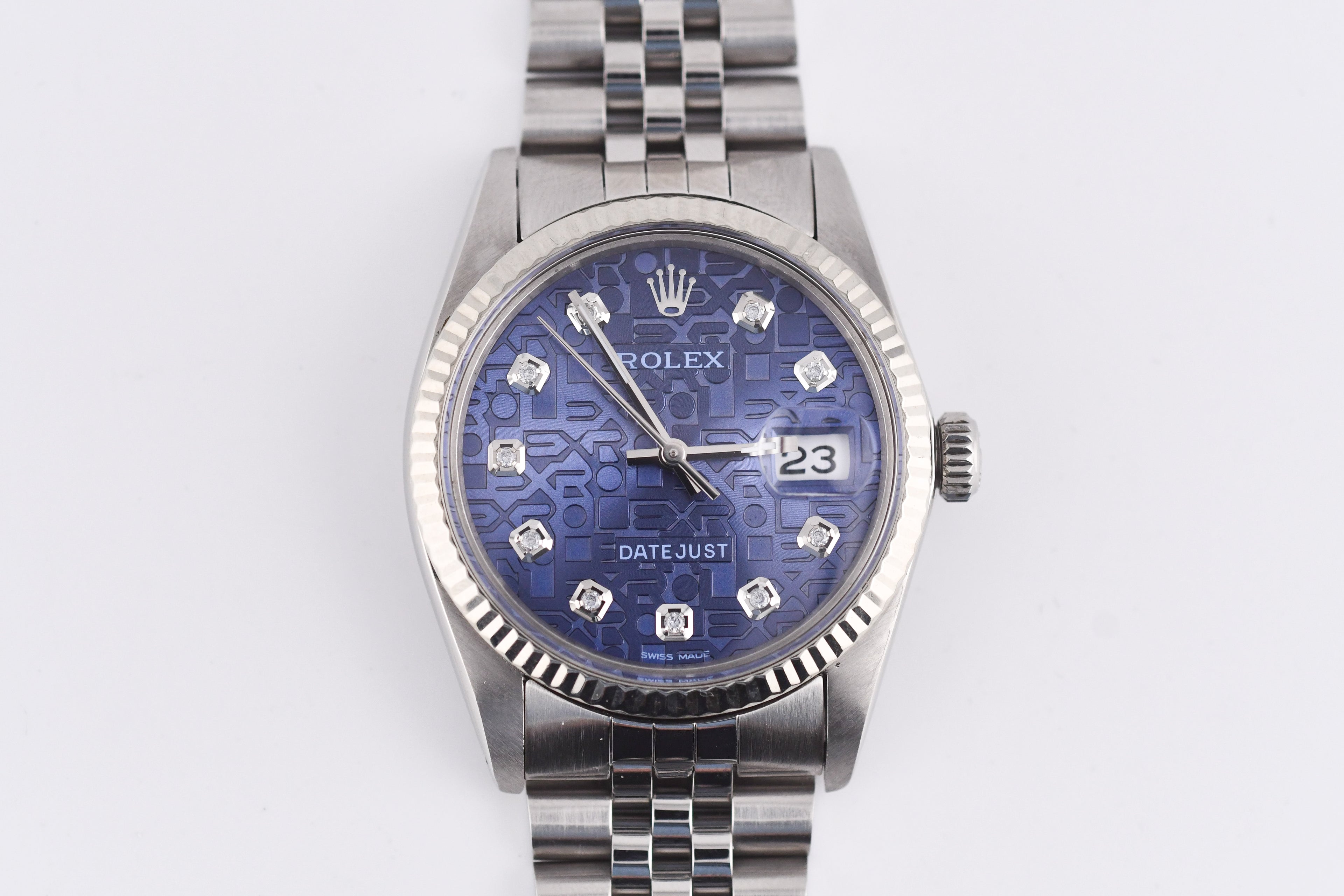 Silver watch with a blue face on a white background