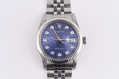 Silver watch with a blue face on a white background