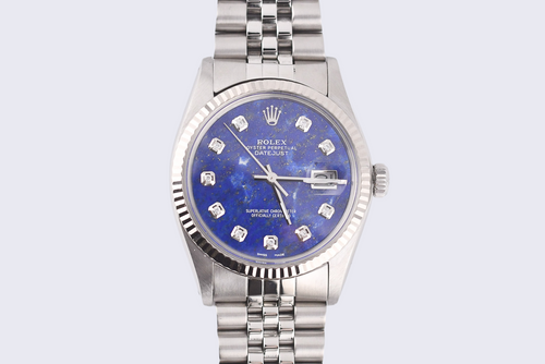 Silver watch with a blue face on a light gray background