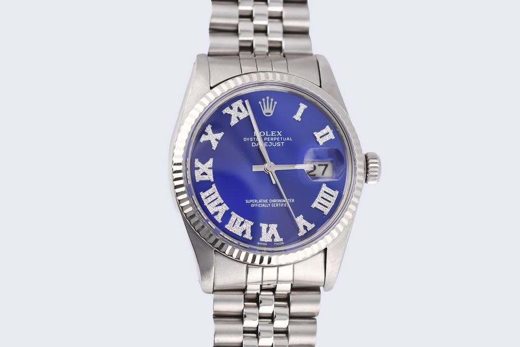 Silver watch with a blue face on a white background