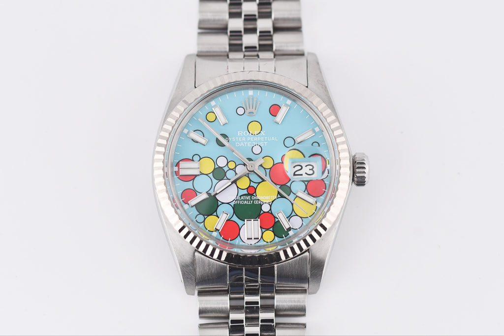 Watch with a colorful face on a white background