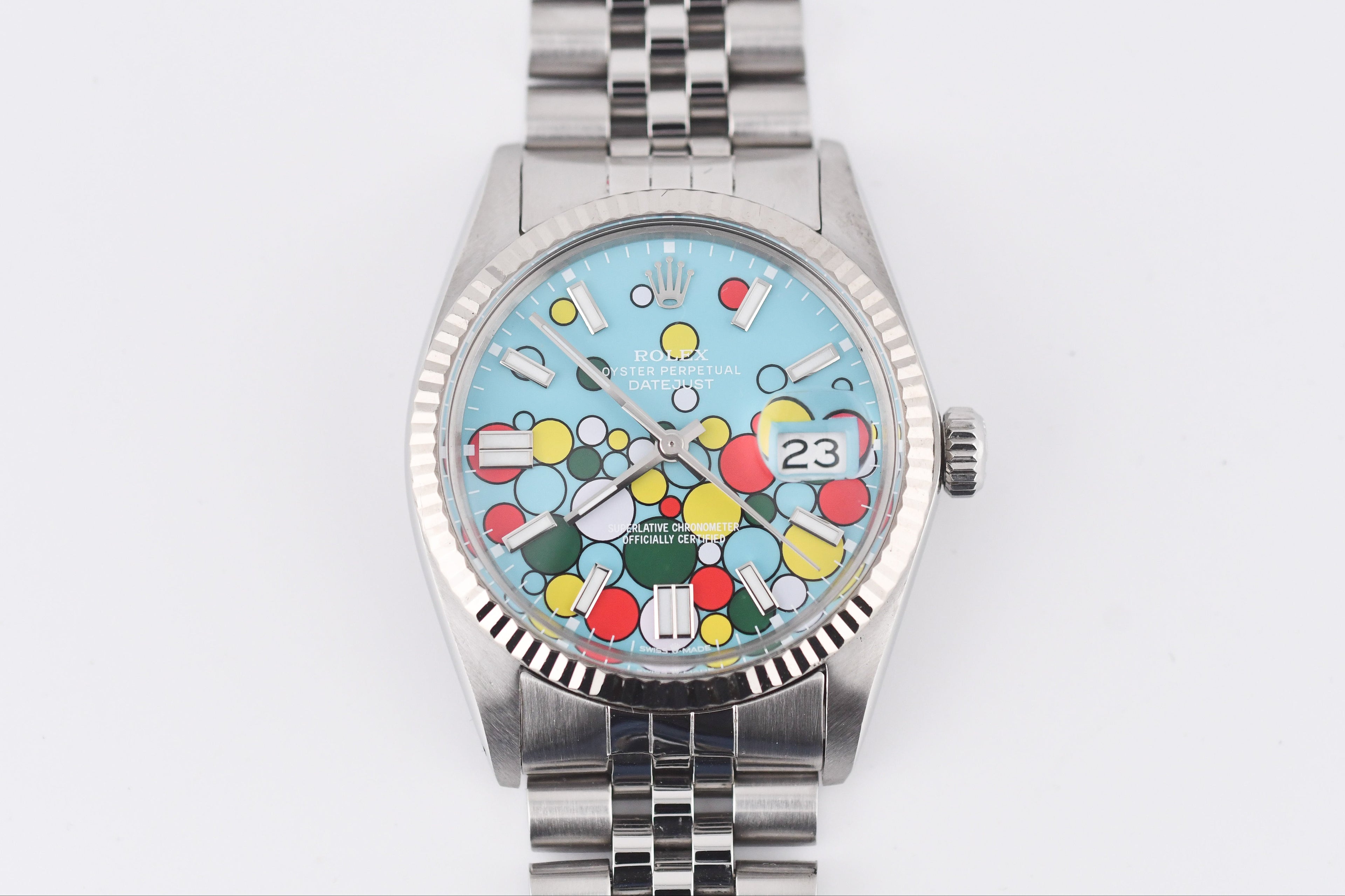 Watch with a colorful face on a white background
