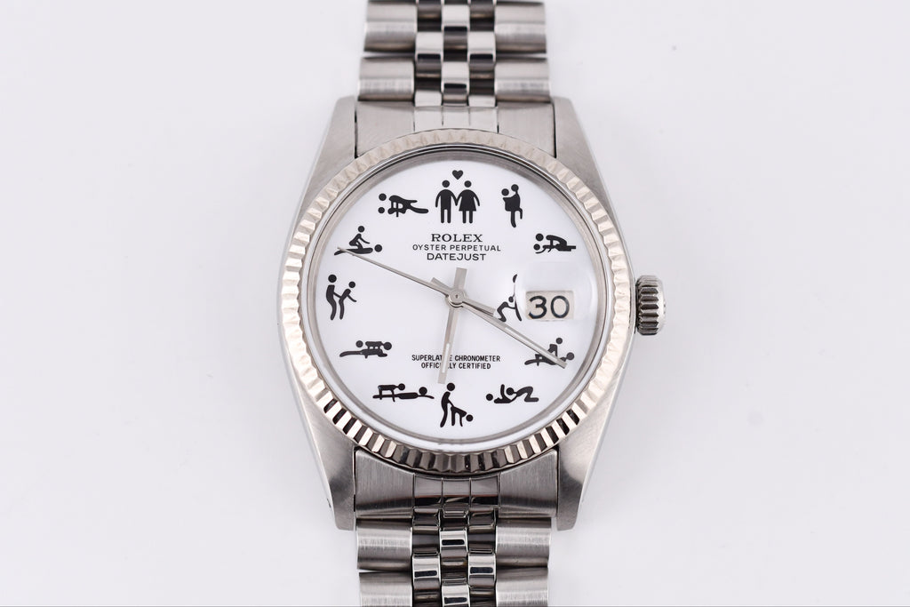 Silver watch with a unique face design on a white background