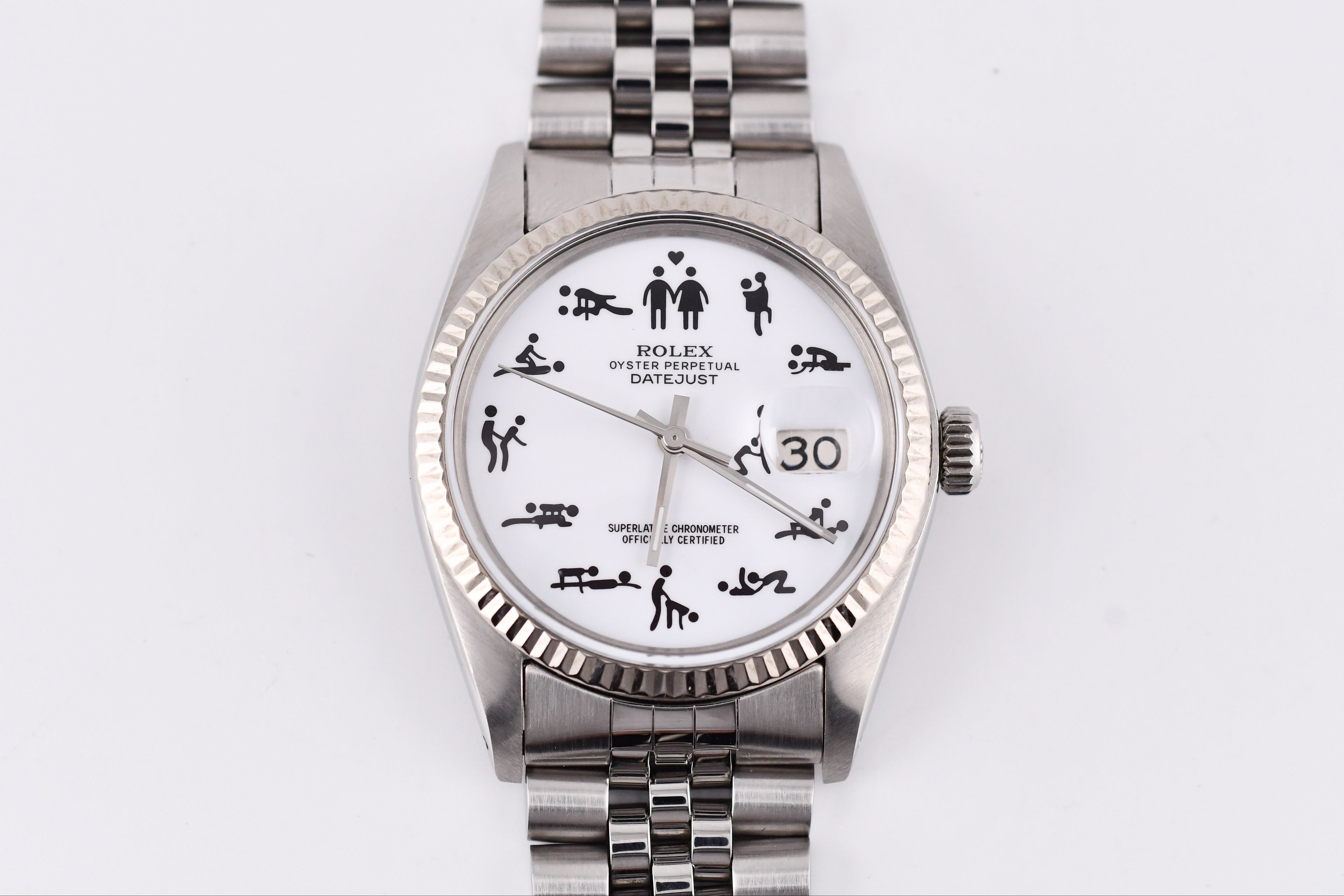 Silver watch with a unique face design on a white background