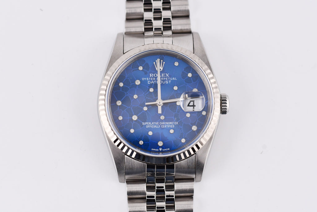 Silver watch with a blue face on a white background