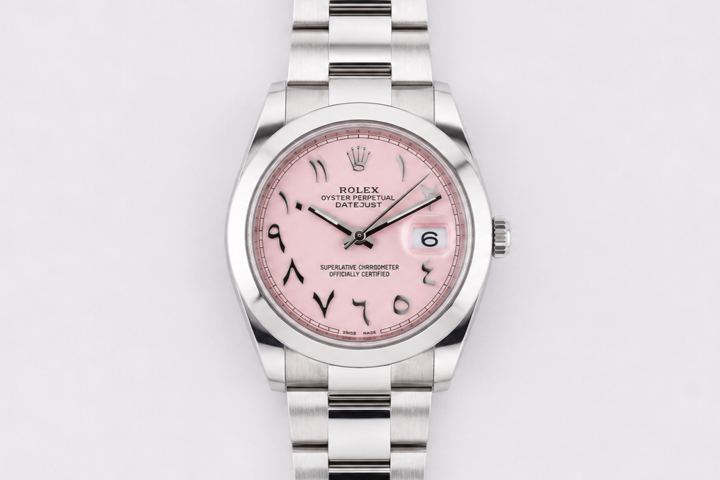Silver watch with a pink face on a light gray background