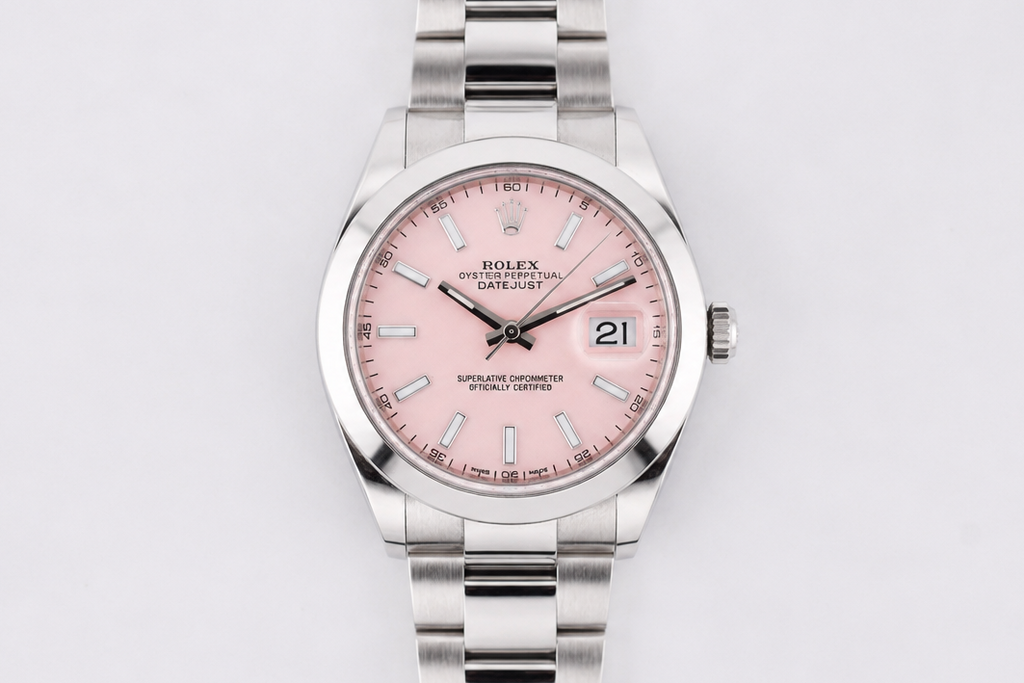 Silver watch with a pink face on a white background