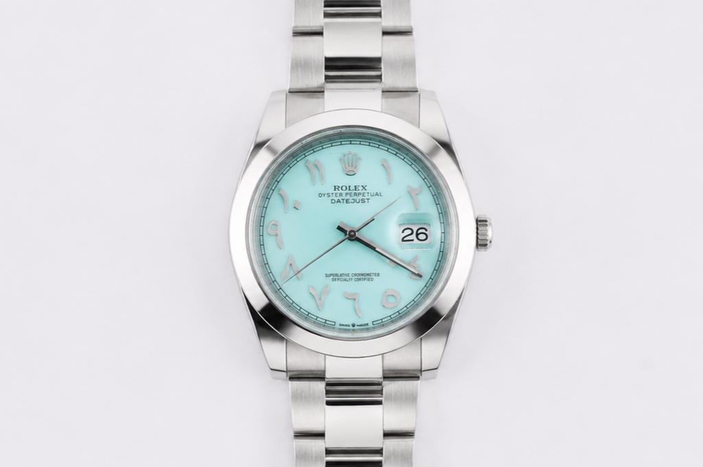 Silver watch with a light blue dial on a white background