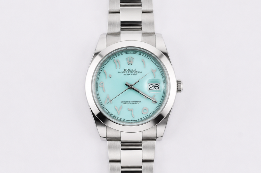 Silver watch with a light blue dial on a white background