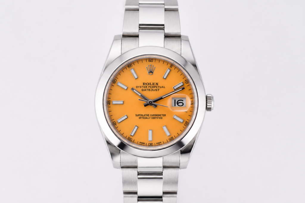 Silver watch with an orange face on a light gray background