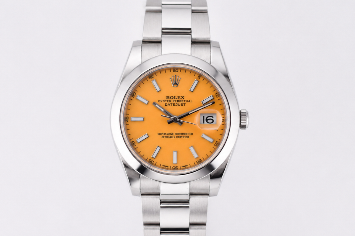 Silver watch with an orange face on a light gray background