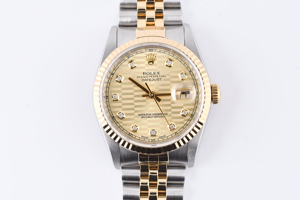 Two-tone Rolex watch with gold and silver band on a white background