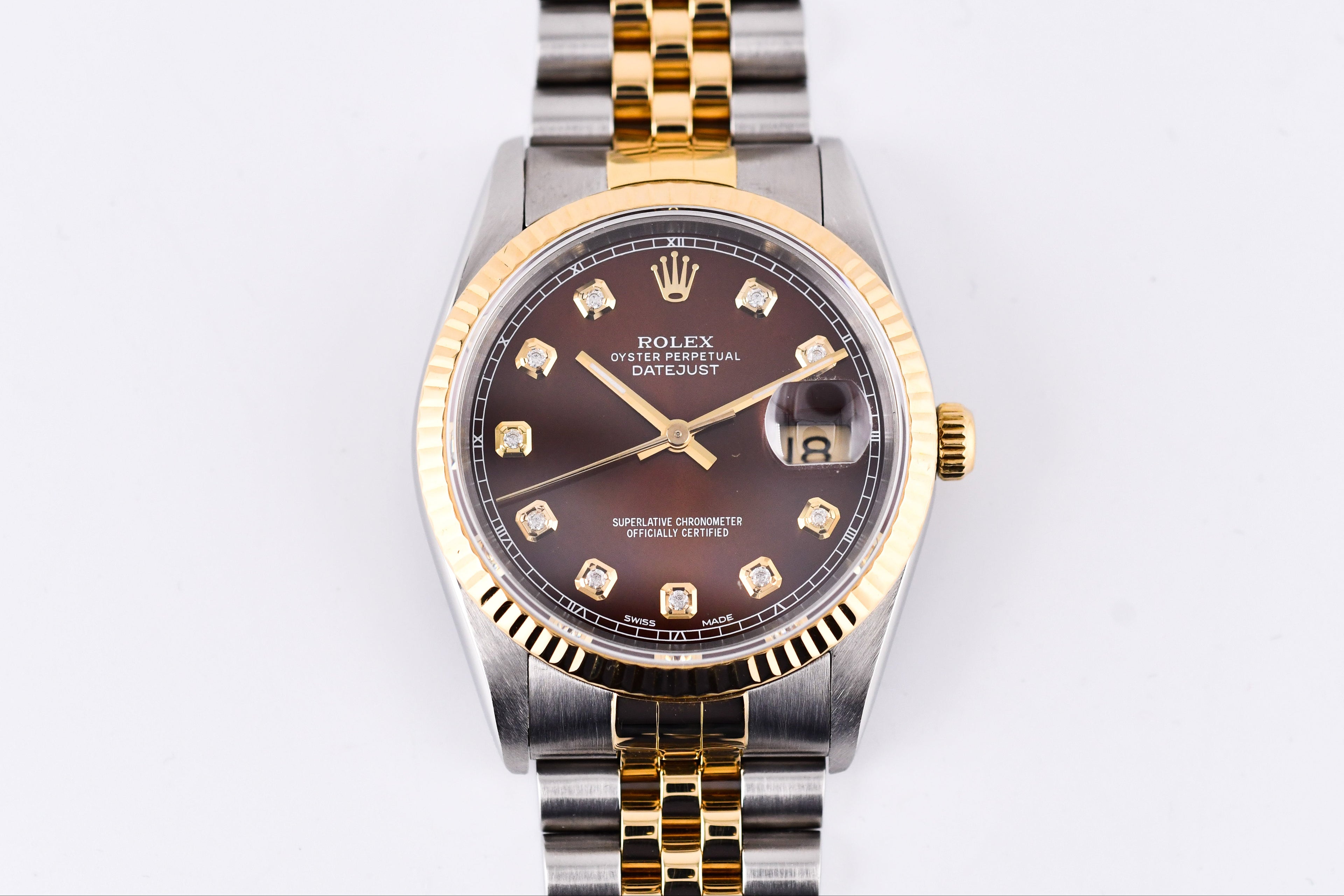 Two-tone Rolex watch with gold and silver band on a white background