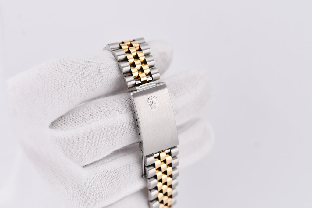 Two-tone watch band with Rolex logo on a white background
