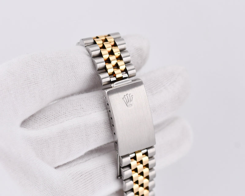 Two-tone watch band with Rolex logo on a white background 