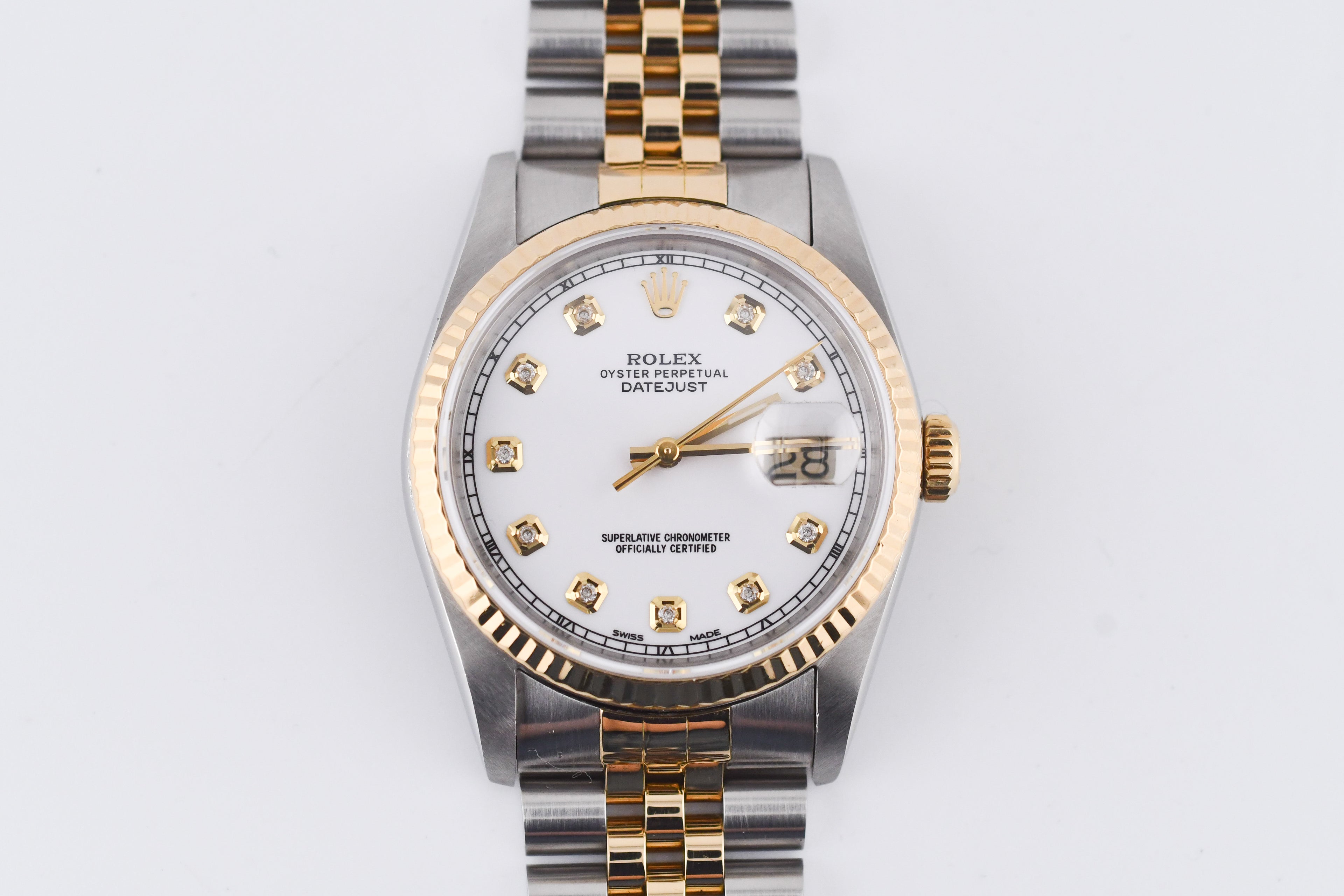 Two-tone watch with gold and silver band on a white background