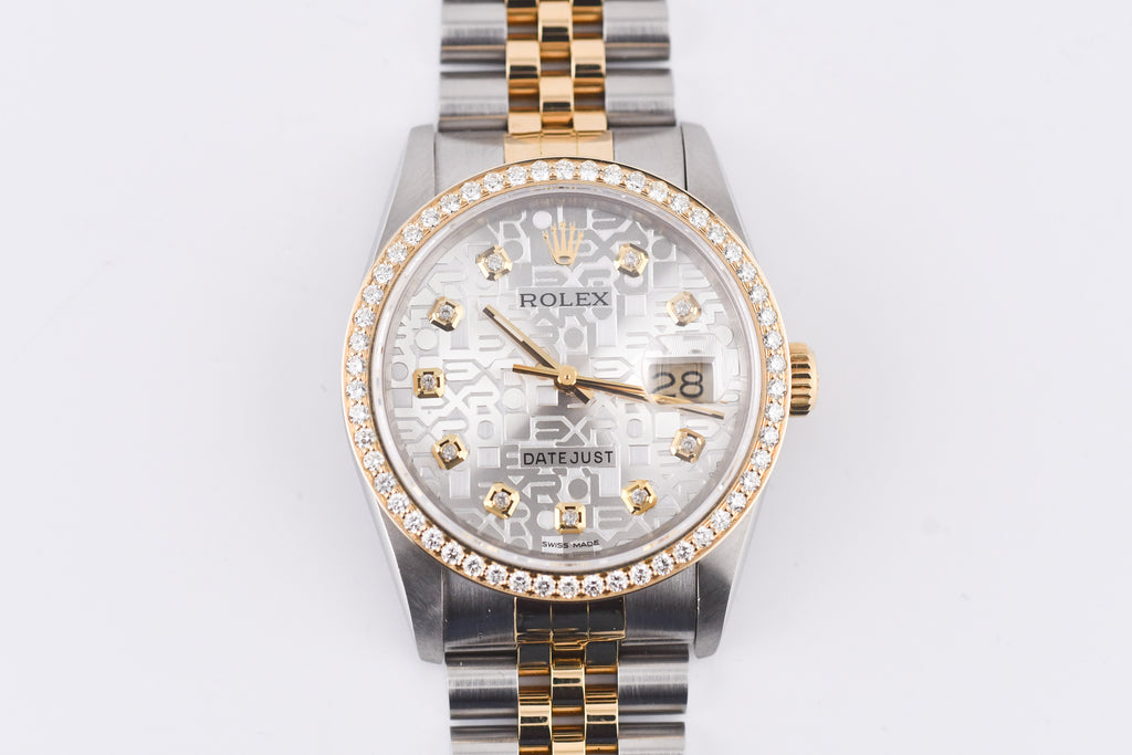 Luxury watch with a silver and gold band on a white background