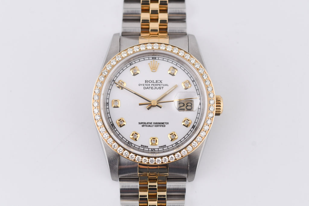 Luxury watch with a silver and gold band on a white background
