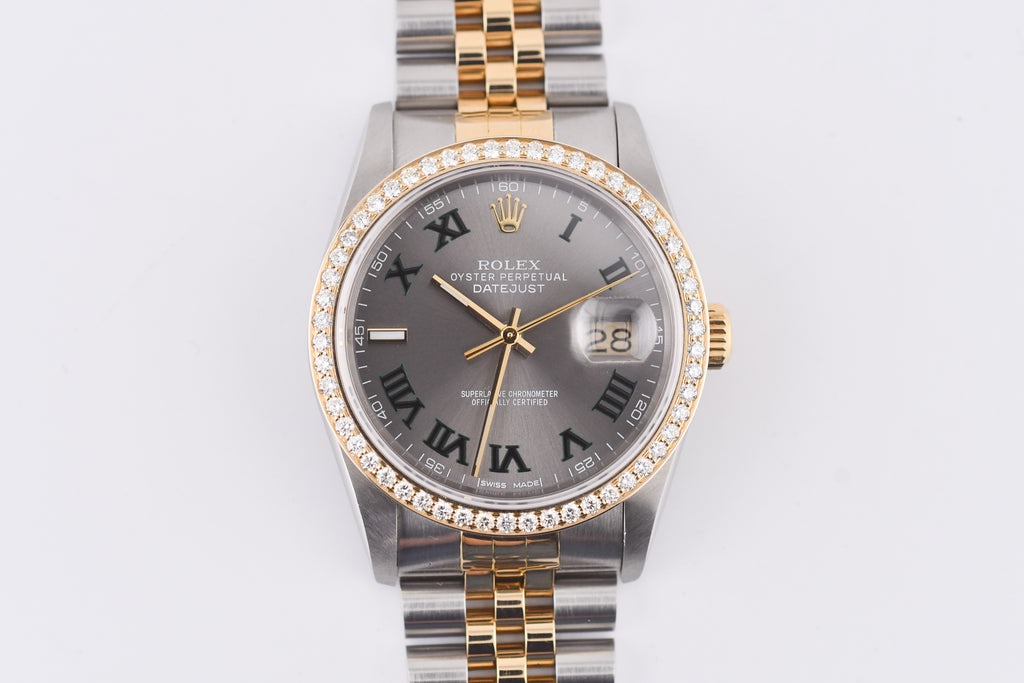 Luxury watch with silver and gold band on a white background