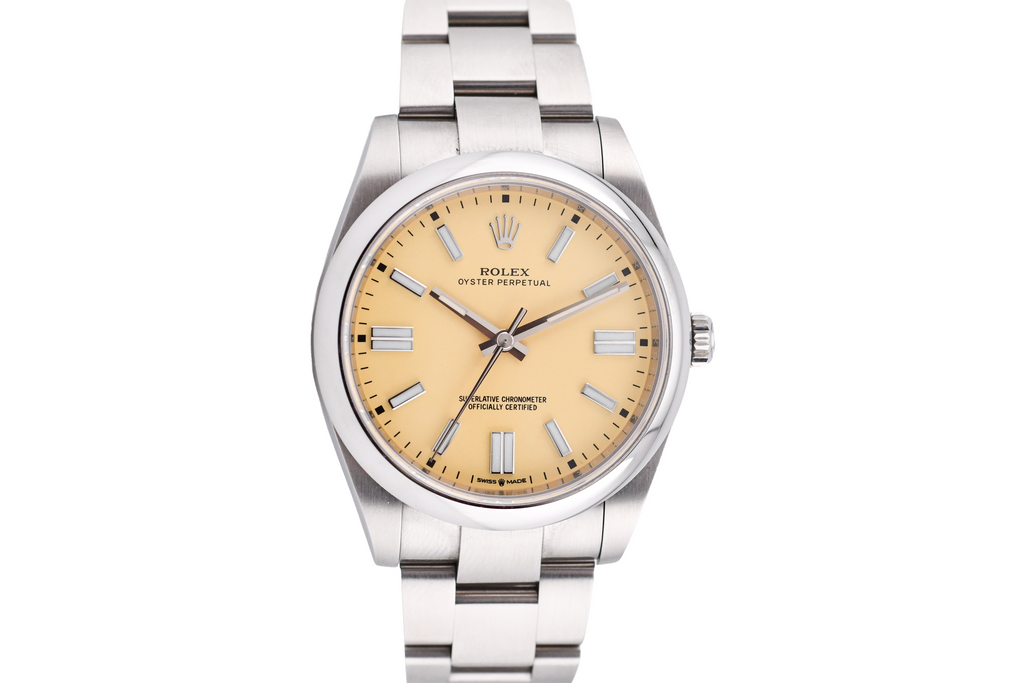 Silver watch with a beige dial on a light gray background