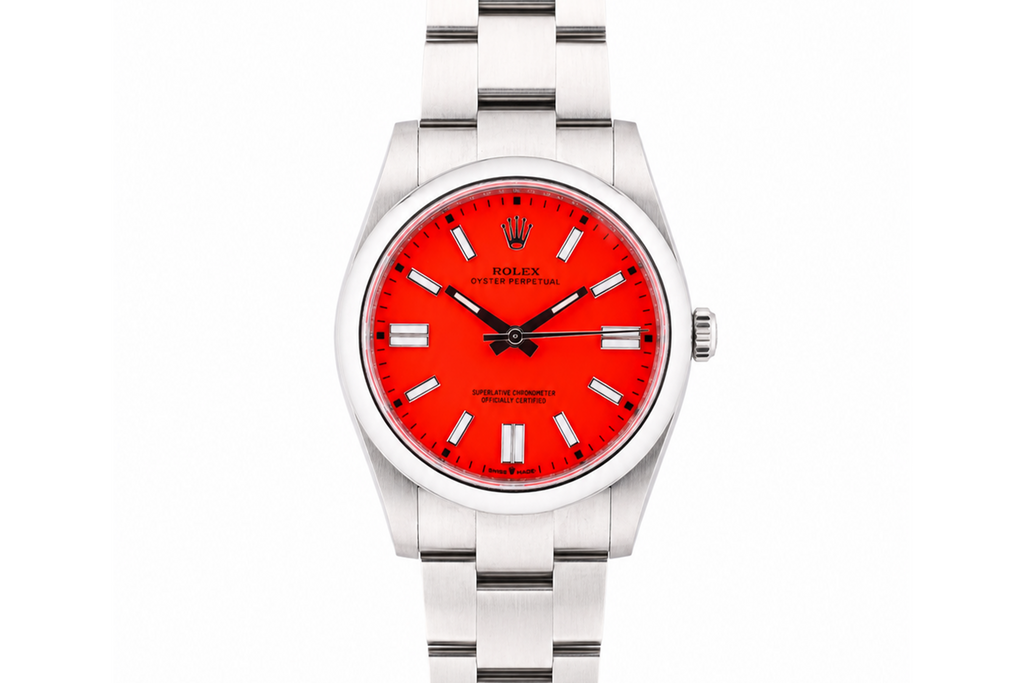 Silver watch with a red face on a white background