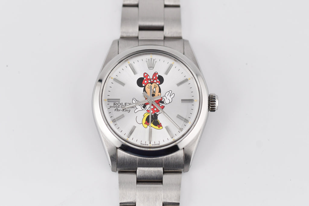 Silver watch with a character faceplate on a white background
