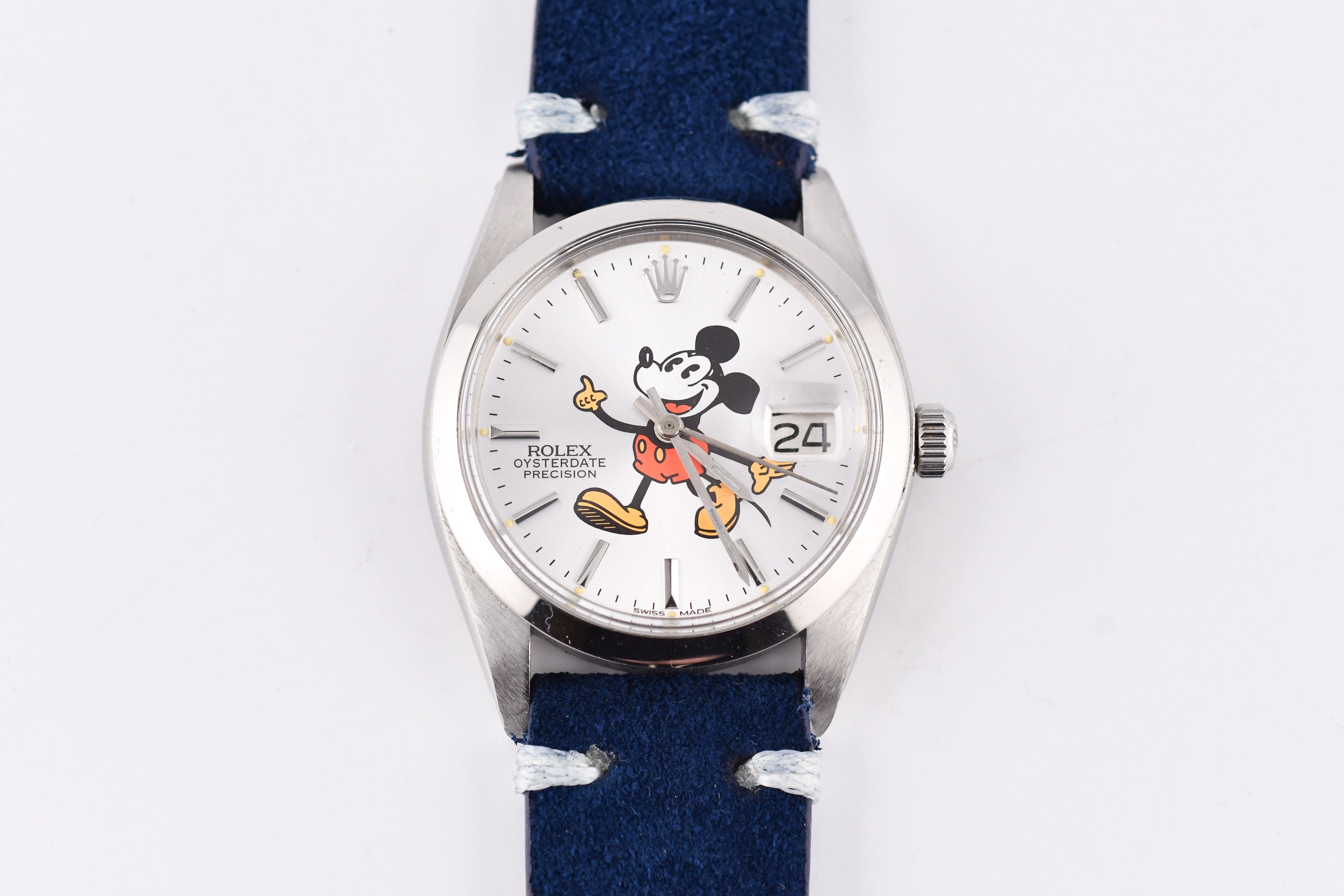 Wristwatch with a blue strap and Mickey Mouse face on the dial against a white background