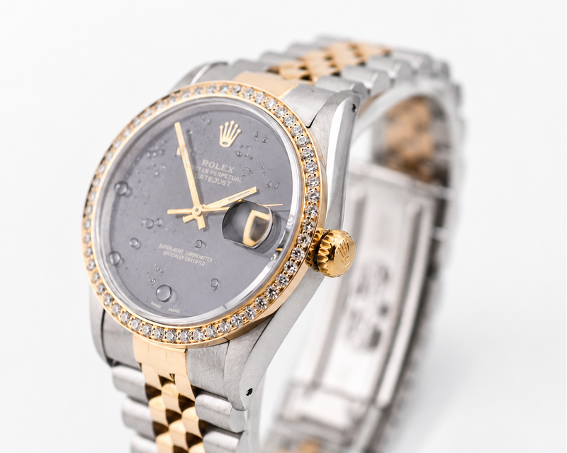 Luxury watch with a two-tone metal band on a white background